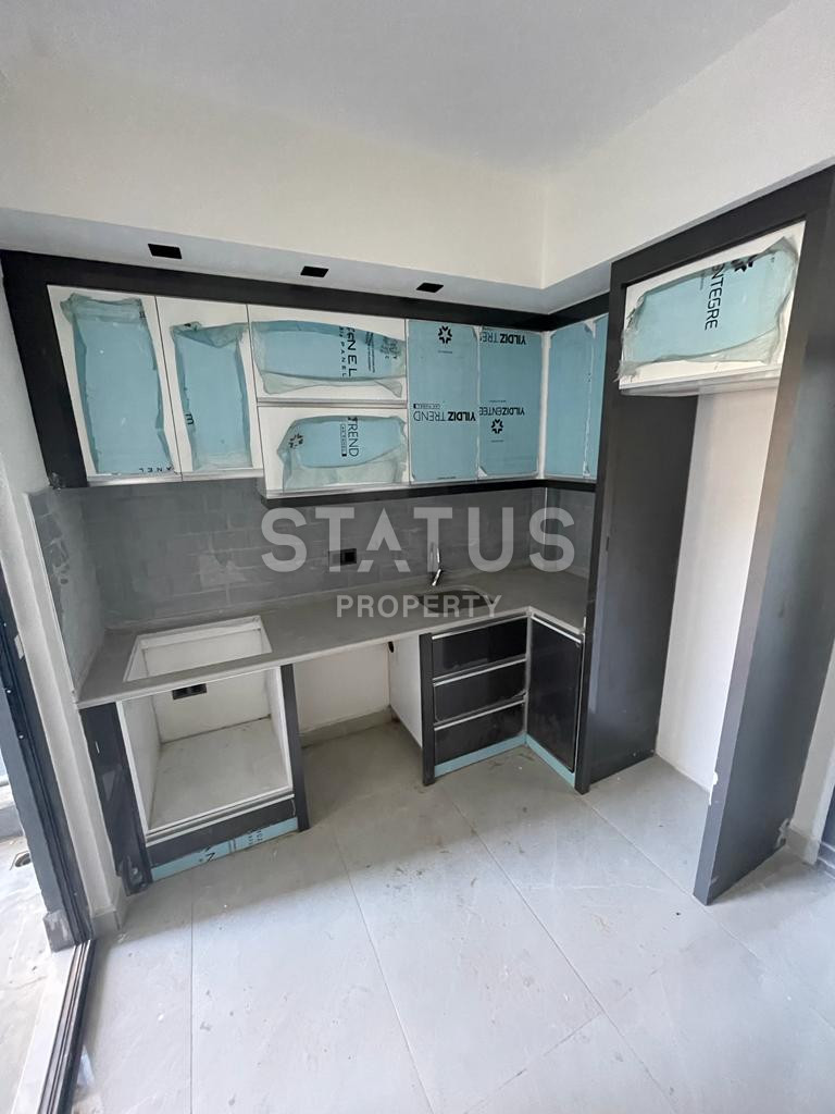 Новая квартира 1+1 в районе Махмутлар, 55 м2 фото 18