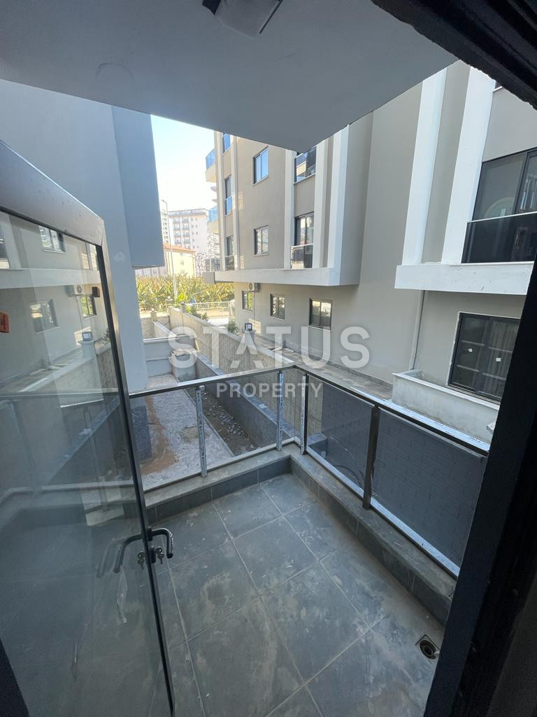 Новая квартира 1+1 в районе Махмутлар, 55 м2 фото 19