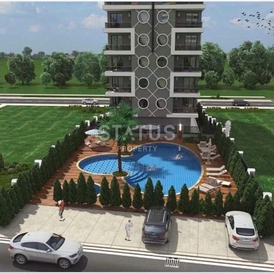 Квартира 1+1 в новом комплексе, 60 кв.м в Махмутларе. фото 1