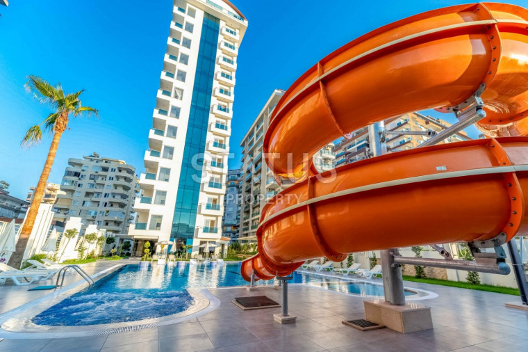 Двухкомнатные апартаменты в элитном комплексе в Махмутларе, новая мебель и техника, 65м2 фото 1