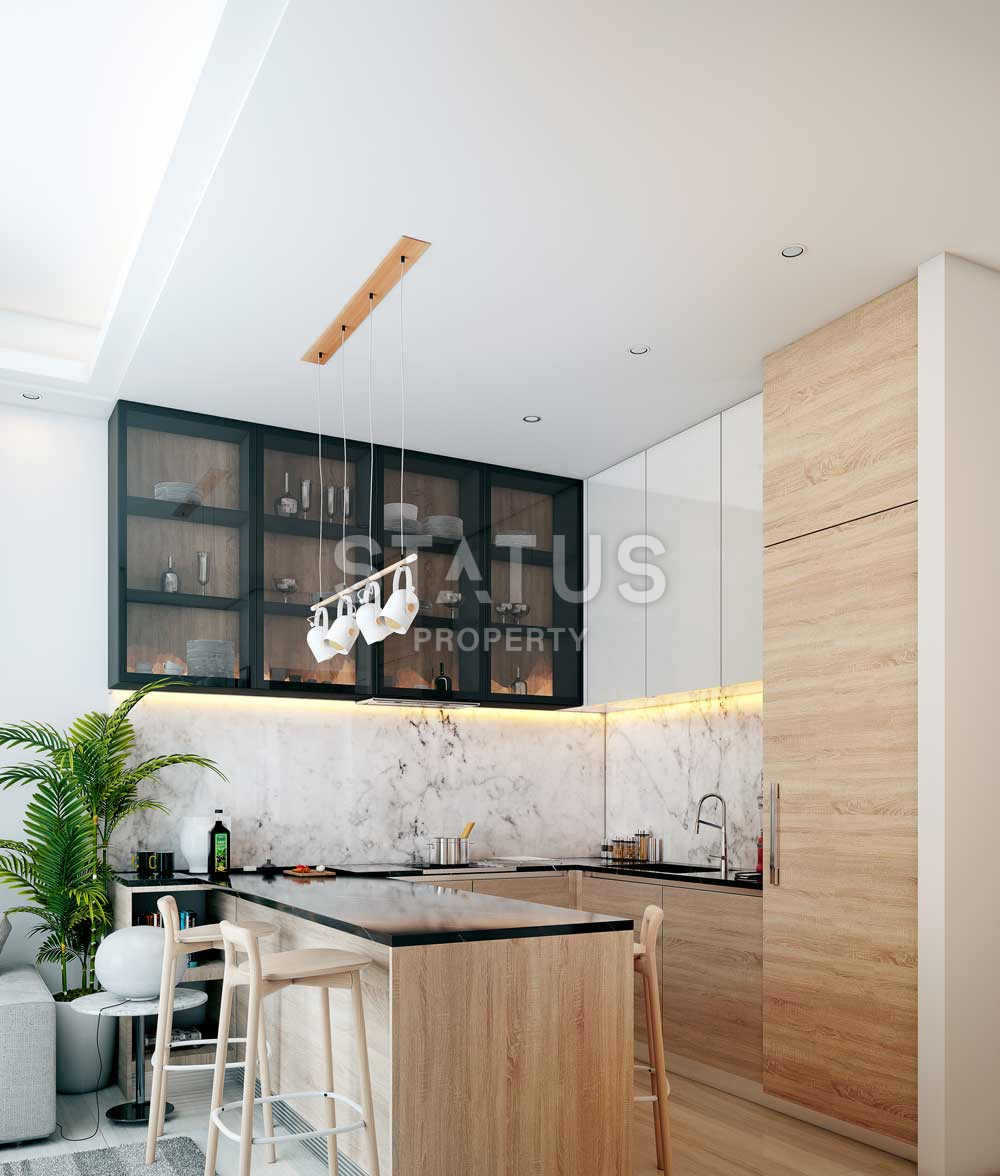 Квартира 1+1 в строящемся проекте в поселке Махмутлар, 53 м2 фото 3