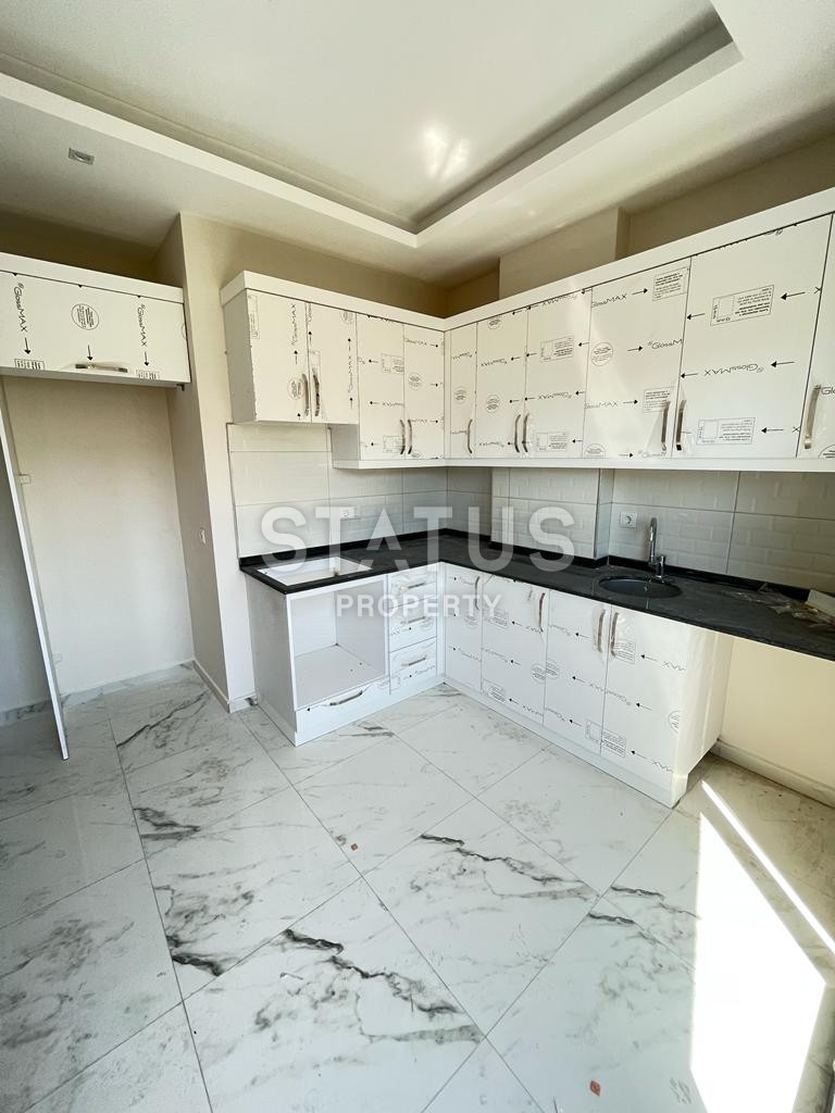 Three-room apartment in the center of Alanya in a new residential complex. 100m2 фото 3