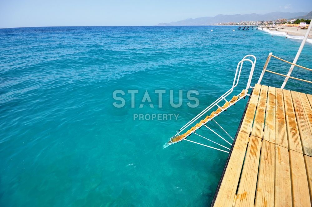 Фешенебельный прект на первой береговой линии с отельной инфраструктурой в районе Каргыджак фото 36