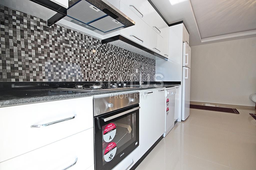 Меблированная трехкомнатная квартира в новом комплексе в Махмутларе, 110 м2. фото 17