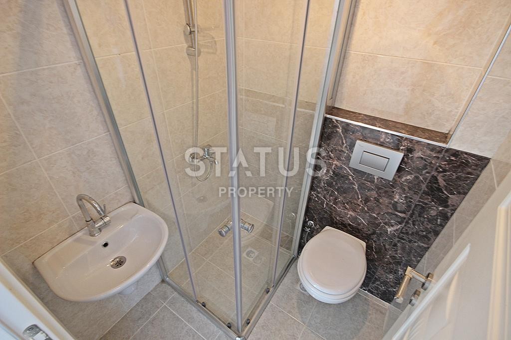 Меблированная трехкомнатная квартира в новом комплексе в Махмутларе, 110 м2. фото 18