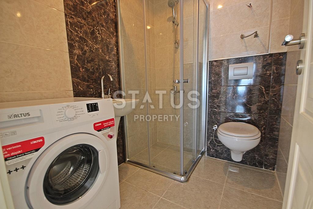 Меблированная трехкомнатная квартира в новом комплексе в Махмутларе, 110 м2. фото 19