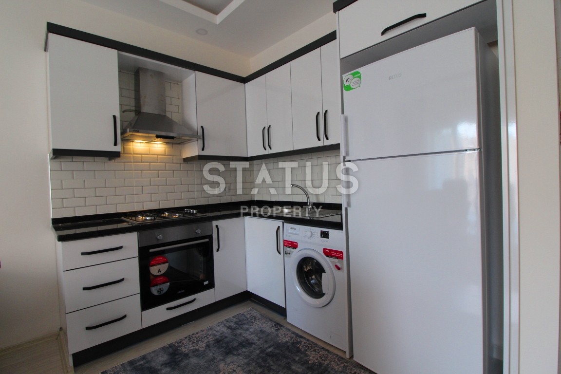 Двухкомнатные апартаменты в комплексе с бассейном в Махмутларе, 65 м2. фото 3