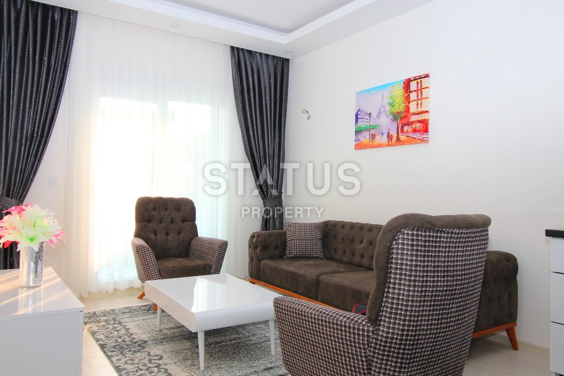 Двухкомнатные апартаменты в комплексе с бассейном в Махмутларе, 65 м2. фото 4