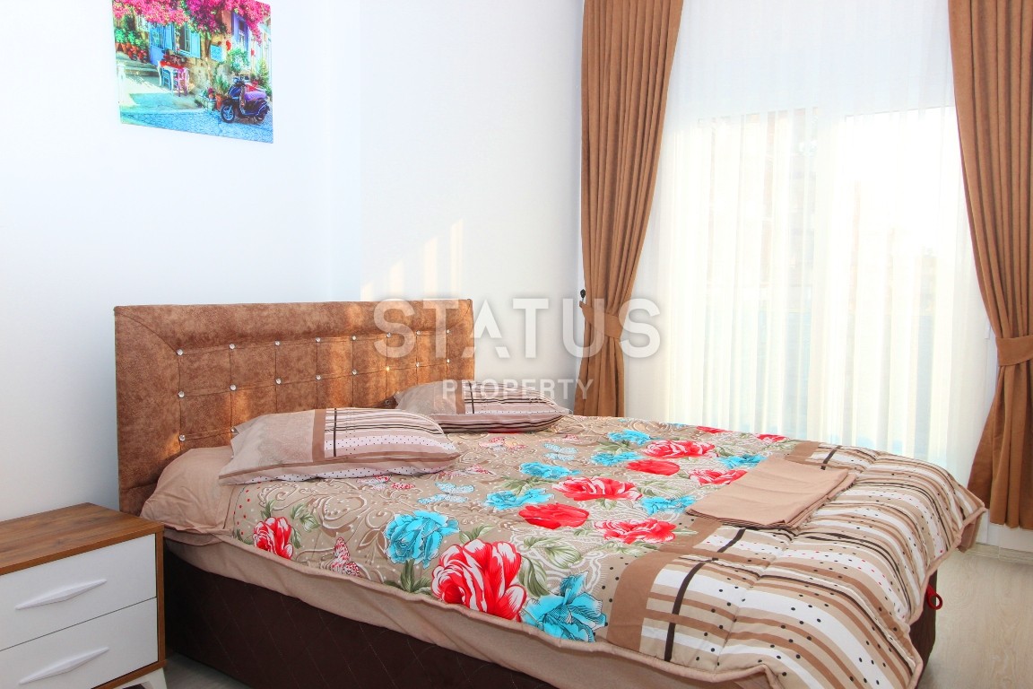 Двухкомнатные апартаменты в комплексе с бассейном в Махмутларе, 65 м2. фото 6