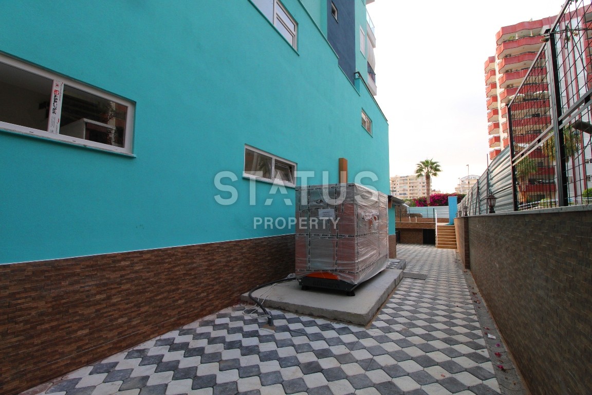 Двухкомнатные апартаменты в комплексе с бассейном в Махмутларе, 65 м2. фото 11