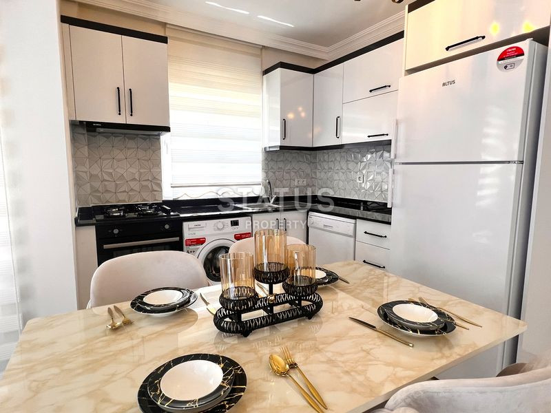 Трёхкомнатная меблированная квартира в доме городского типа в Махмутларе. 90м2 фото 16