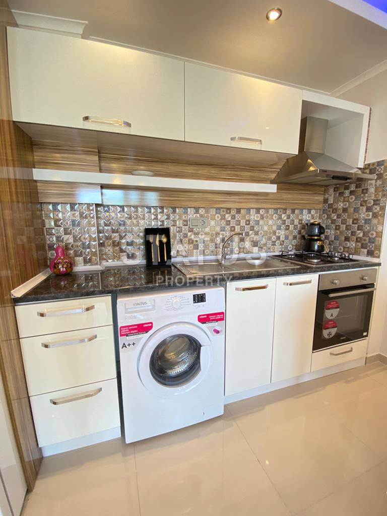 One bedroom furnished apartment with sea view in Mahmutlar. 65m2 фото 16