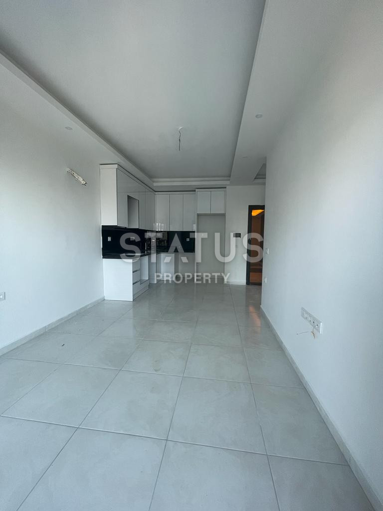 Двухкомнатная квартира в ЖК с отельной инфраструктурой в 600м от моря в Махмутларе. 60м2 фото 5