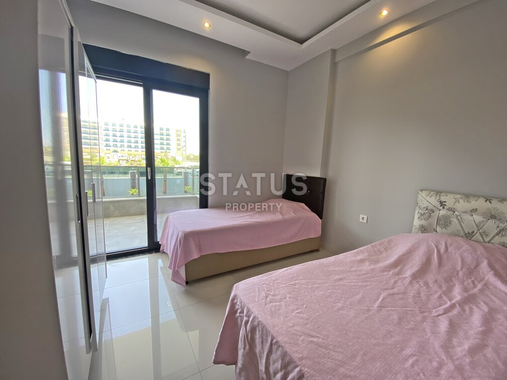 Garden duplex 2+1 at 250 250m from the sea in a residential complex with full infrastructure in Kargicak. 106m2. фото 6