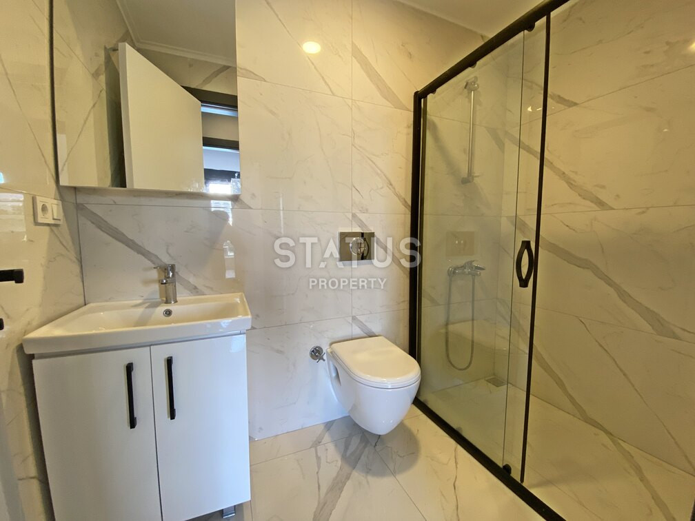 Garden duplex 2+1 at 250 250m from the sea in a residential complex with full infrastructure in Kargicak. 106m2. фото 7