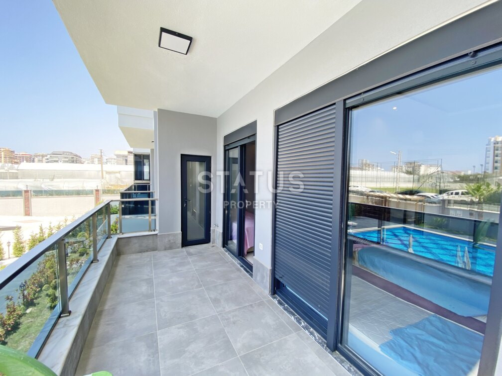 Garden duplex 2+1 at 250 250m from the sea in a residential complex with full infrastructure in Kargicak. 106m2. фото 10