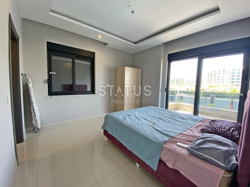 Garden duplex 2+1 at 250 250m from the sea in a residential complex with full infrastructure in Kargicak. 106m2. фото 11