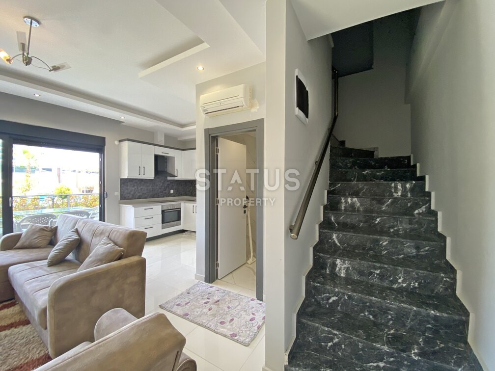 Garden duplex 2+1 at 250 250m from the sea in a residential complex with full infrastructure in Kargicak. 106m2. фото 16