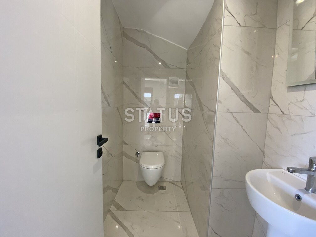 Garden duplex 2+1 at 250 250m from the sea in a residential complex with full infrastructure in Kargicak. 106m2. фото 21