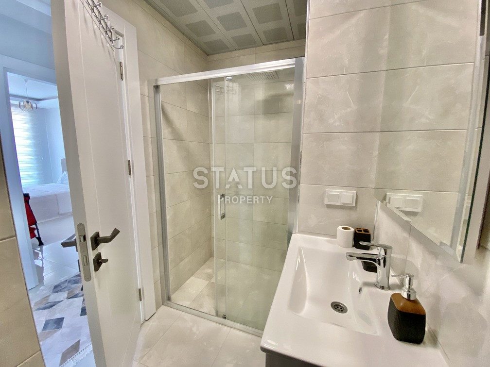 Уютная светлая трёхкомнатная квартира в первой береговой линии в Махмутларе. 85м2 фото 5