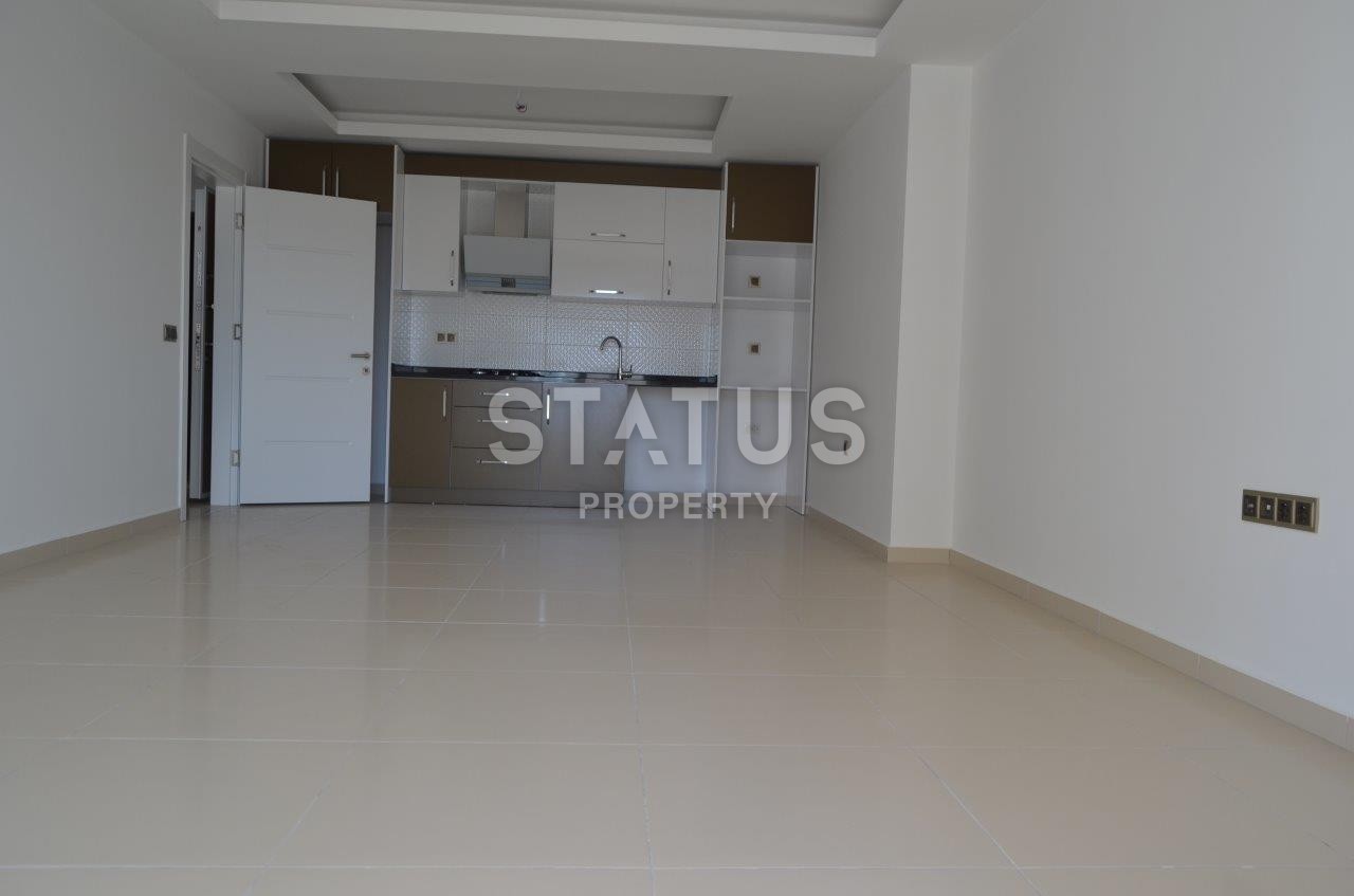 Двухкомнатная квартира в новом комплексе в Махмутларе, 68 м2 фото 11