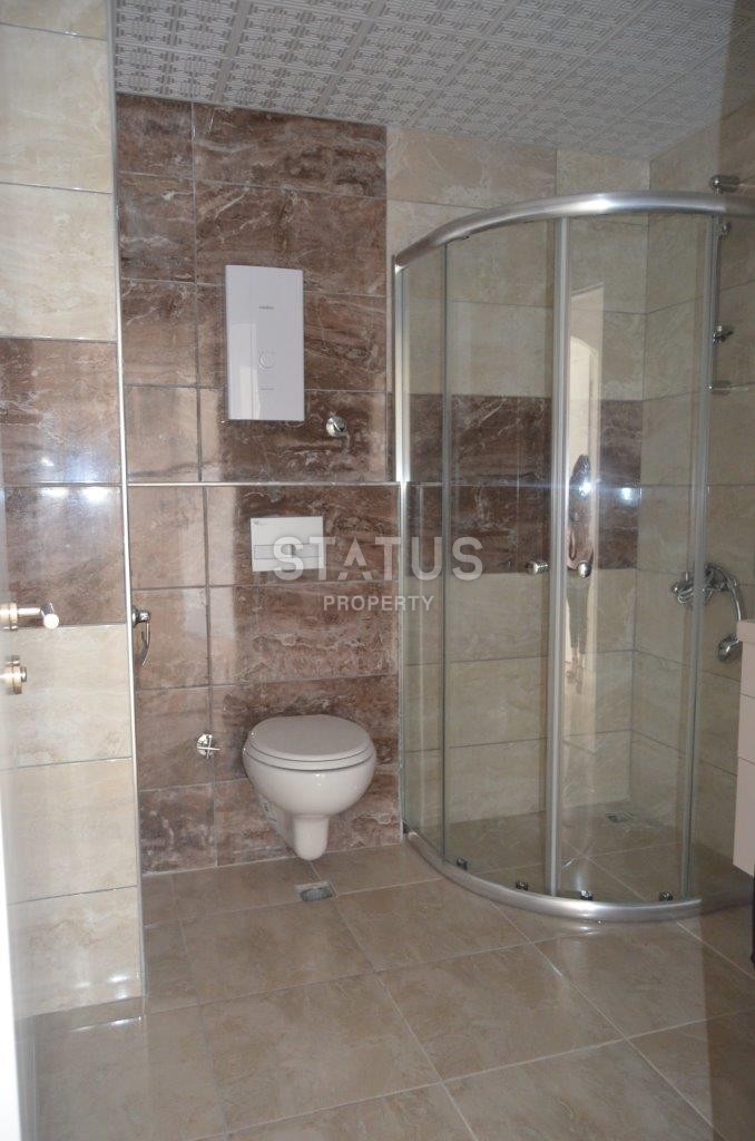 Двухкомнатная квартира в новом комплексе в Махмутларе, 68 м2 фото 14