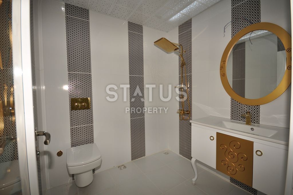 Меблированная просторная двухкомнатная квартира в комплексе с бассейном в Махмутларе, 75 м2. фото 21