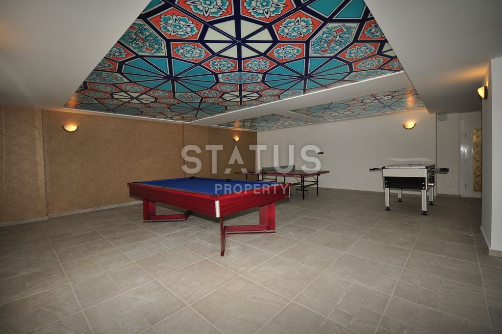 Меблированная просторная двухкомнатная квартира в комплексе с бассейном в Махмутларе, 75 м2. фото 17