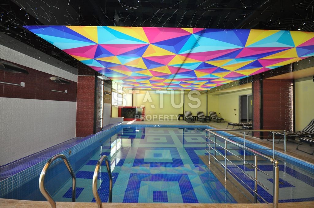 Меблированная просторная двухкомнатная квартира в комплексе с бассейном в Махмутларе, 75 м2. фото 13