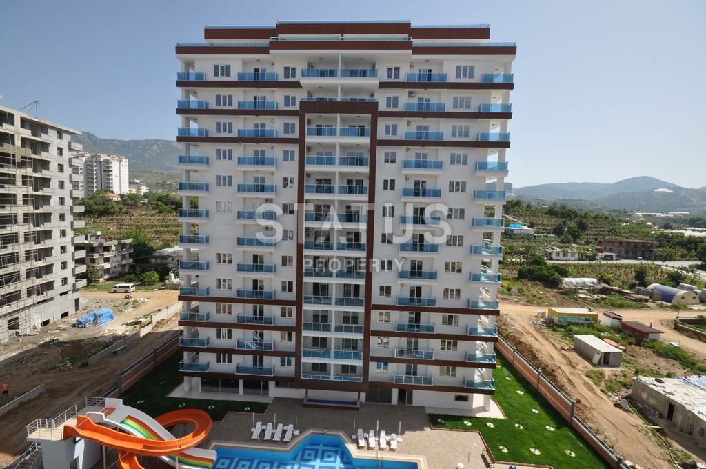 Меблированная просторная двухкомнатная квартира в комплексе с бассейном в Махмутларе, 75 м2. фото 27