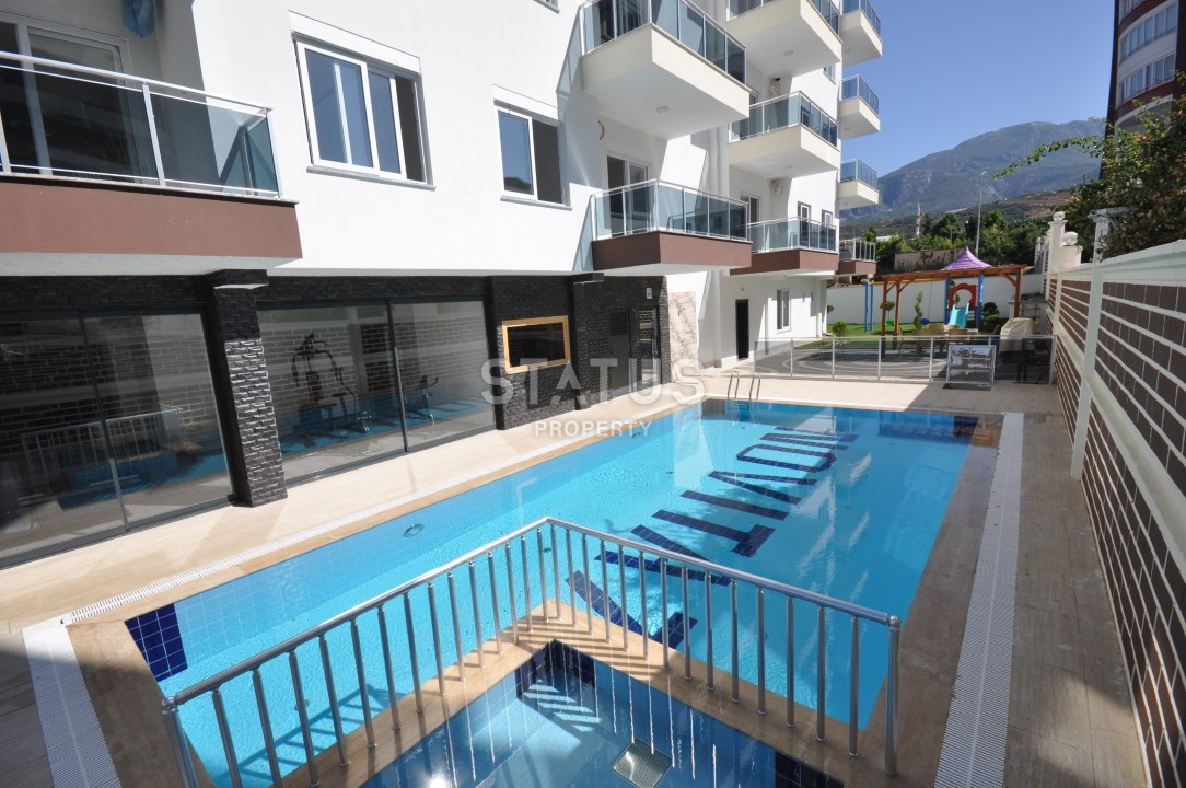 Меблированные апартаменты 1+1 в районе Махмутлар, 56 м2 фото 2