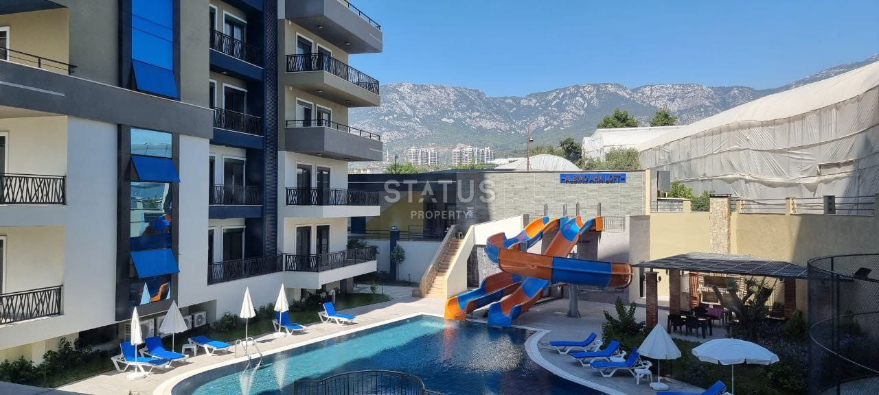 Две квартиры 1+1 в одном комплексе в Махмутларе! 56 м2 фото 13