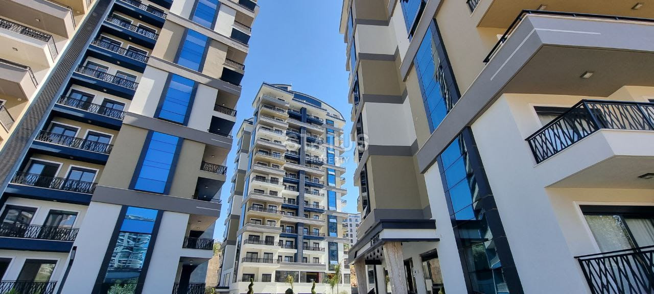 Две квартиры 1+1 в одном комплексе в Махмутларе! 56 м2 фото 14