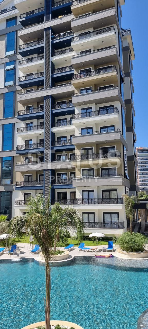 Две квартиры 1+1 в одном комплексе в Махмутларе! 56 м2 фото 16