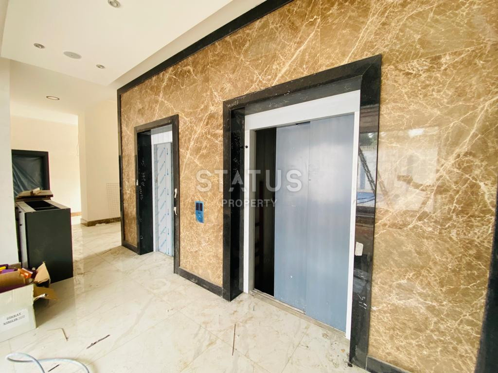 Две новые квартиры 1+1 в комплексе отельного типа в Махмутларе. 51м2 фото 3