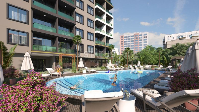 Достойный жилой комплекс с привлекательными ценами в 600м от моря в Авсалларе. 50м2 – 116м2 фото 12