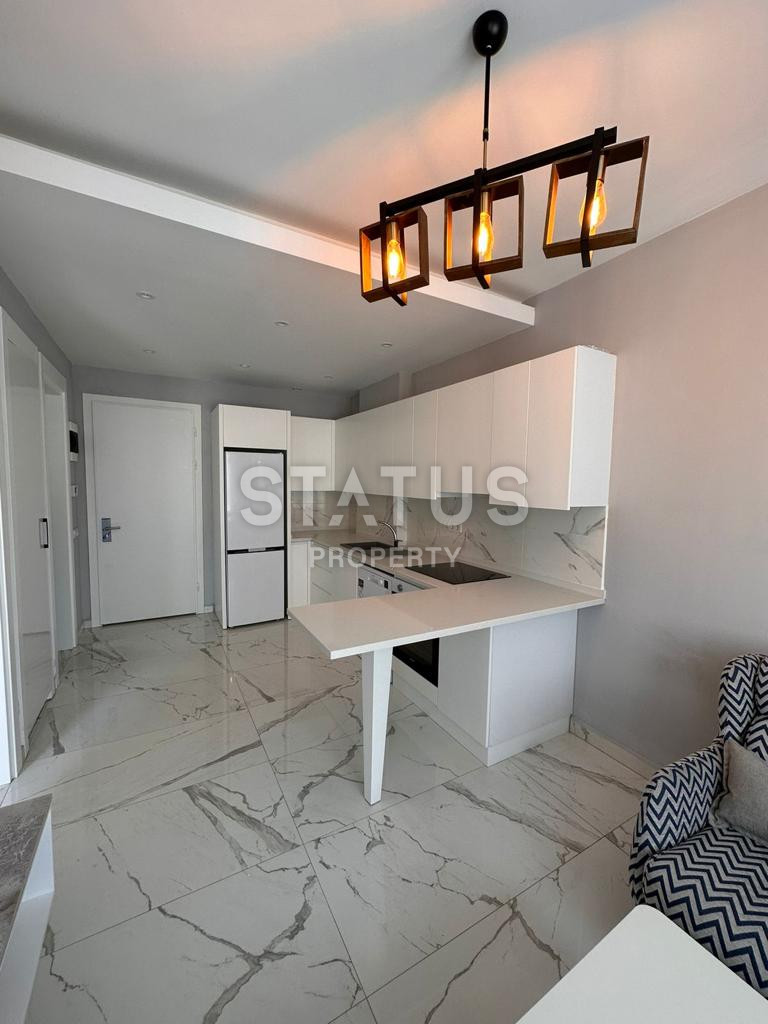 Двухкомнатная квартира с мебелью в новом комплексе в 100 метрах от пляжа в центре Аланьи. 50м2 фото 3