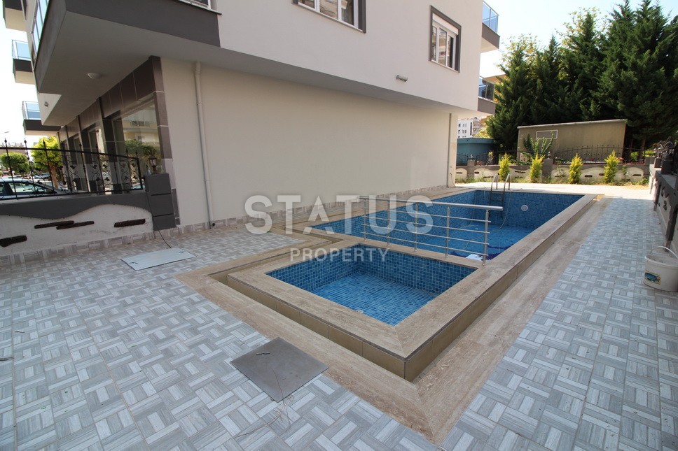 Меблированная двухкомнатная квартира в центре района Махмутлар, 75 м2 фото 26