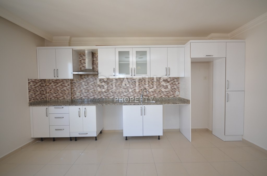 Недорогая квартира в Махмутларе с красивым видом на горы и боковым видом на море. 100 кв.м. фото 8