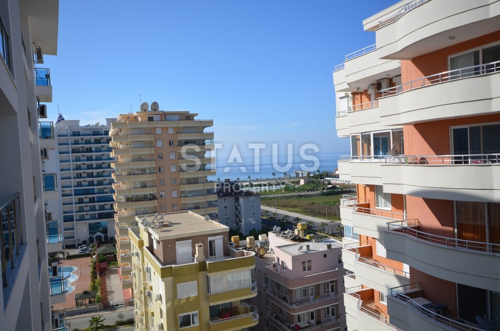 Недорогая квартира в Махмутларе с красивым видом на горы и боковым видом на море. 100 кв.м. фото 12