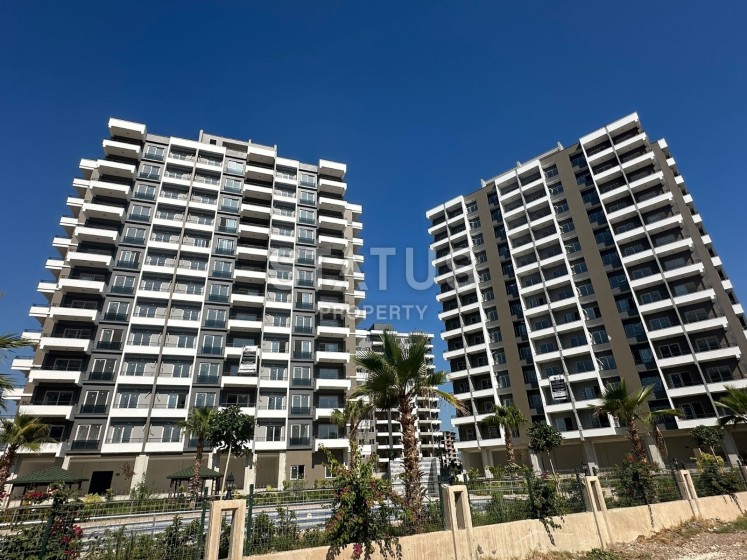 Квартира 1+1 в новом комплексе в районе Томюк, Арпачбахшиш фото 1