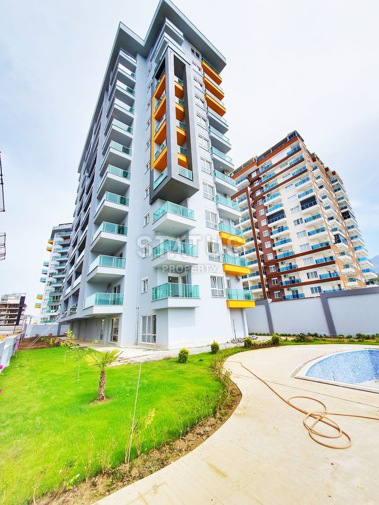 Недорогая квартира 1+1 в новом комплексе в Махмутларе, 65 м2 фото 1