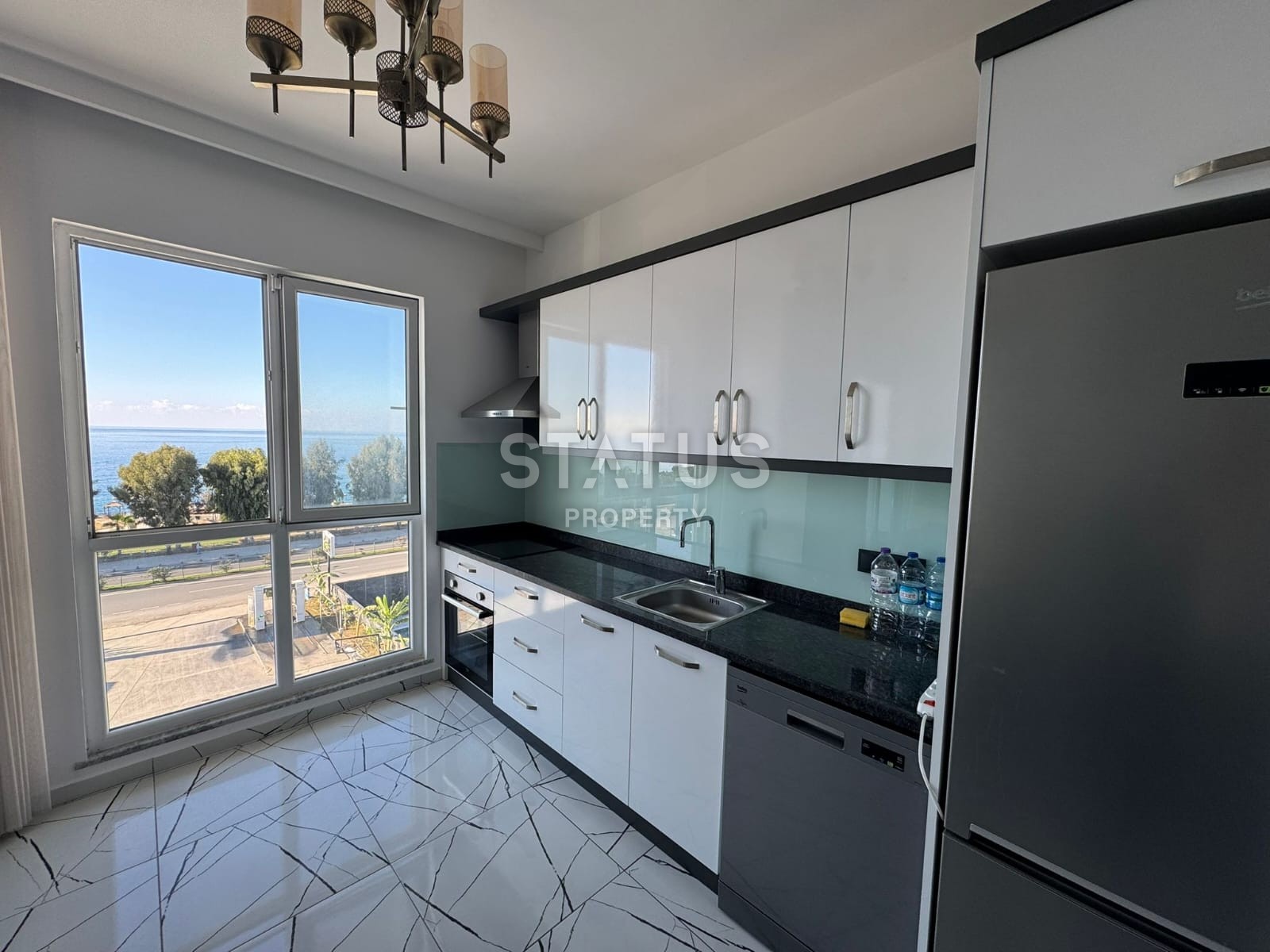 Двухуровневый дуплекс 2+1 с прямым видом на море на первой береговой линии в Каргыджак фото 3