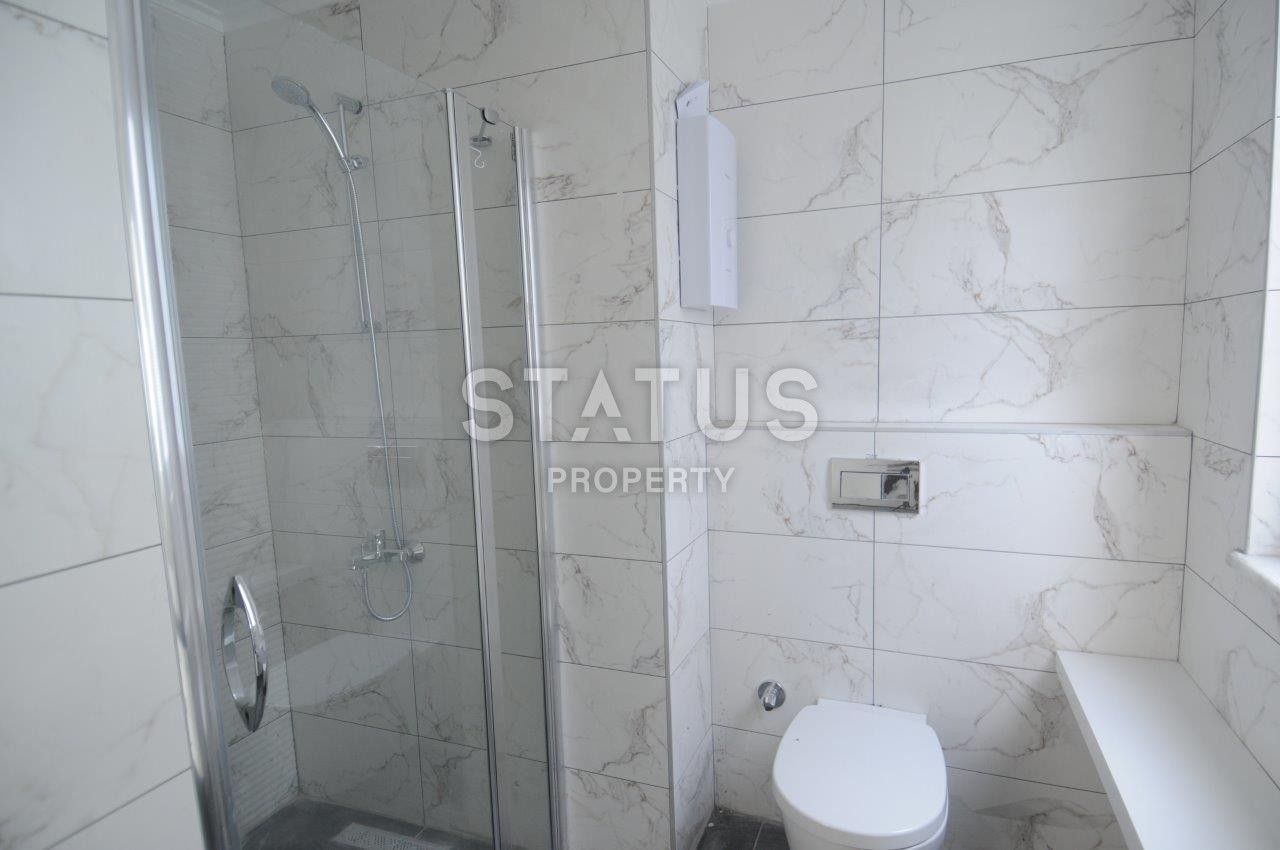 Двухкомнатная квартира от собственника в новом доме в районе Махмутлар по хорошей цене фото 16