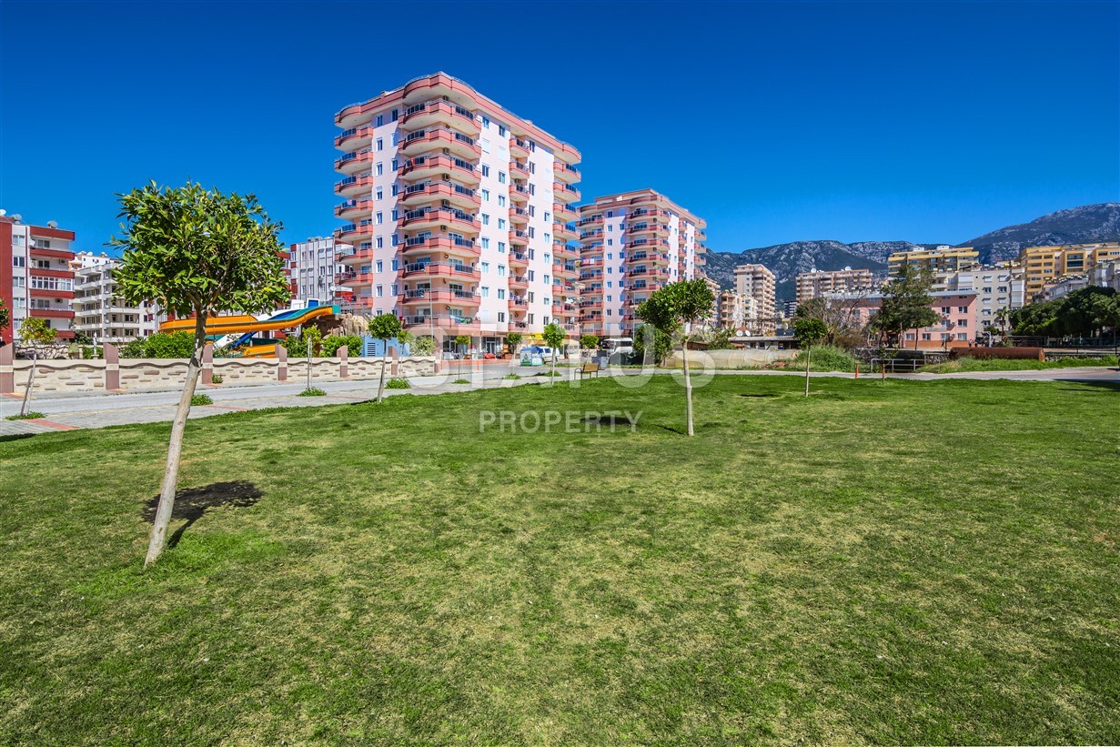 Апартаменты у моря для большой семьи в современном комплексе в центре Махмутлара фото 2