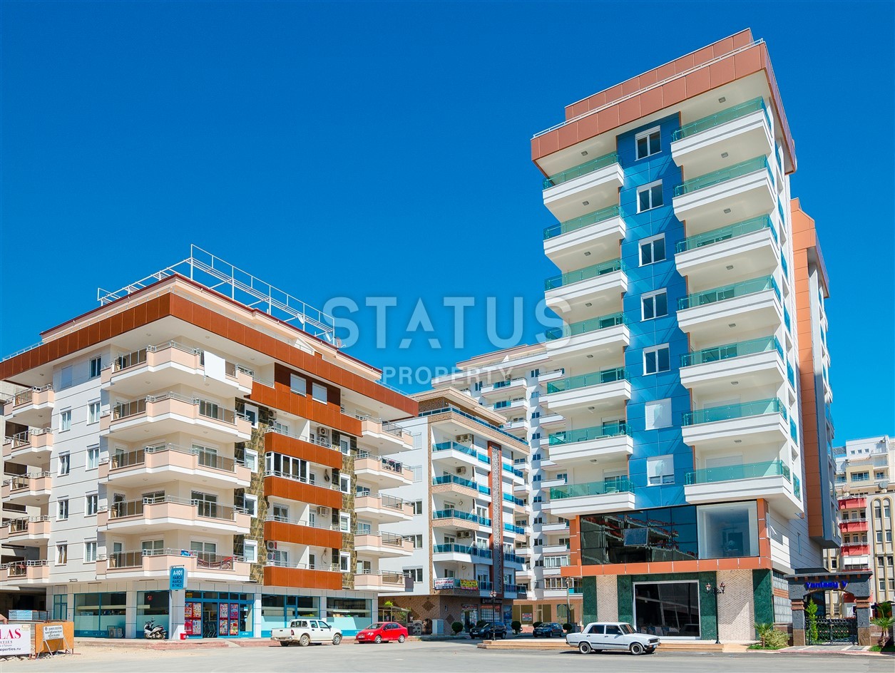 Недвижимость в Алании  у самого берега моря в популярном районе Махмутлар фото 1