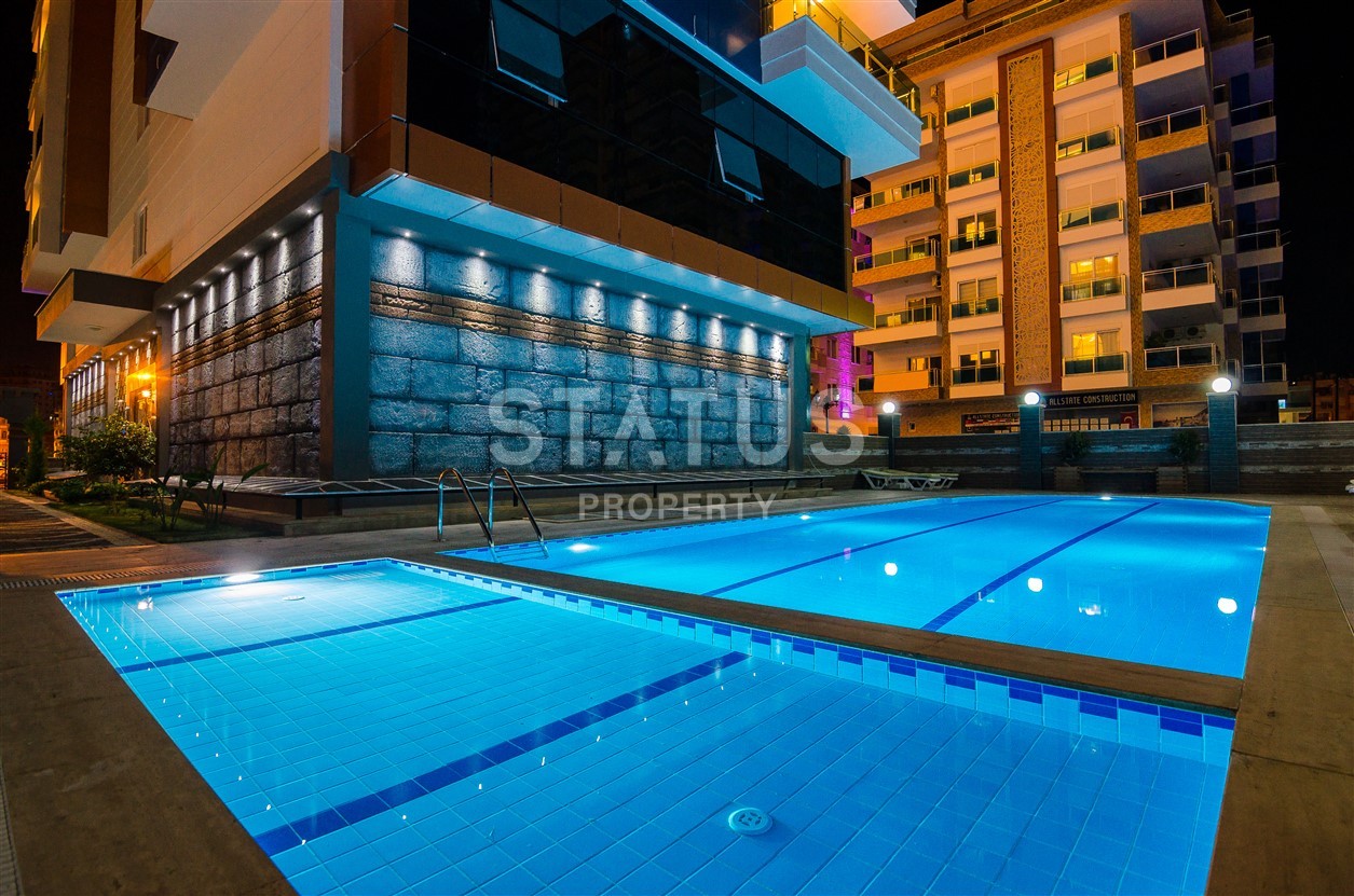 Недвижимость в Алании  у самого берега моря в популярном районе Махмутлар фото 4