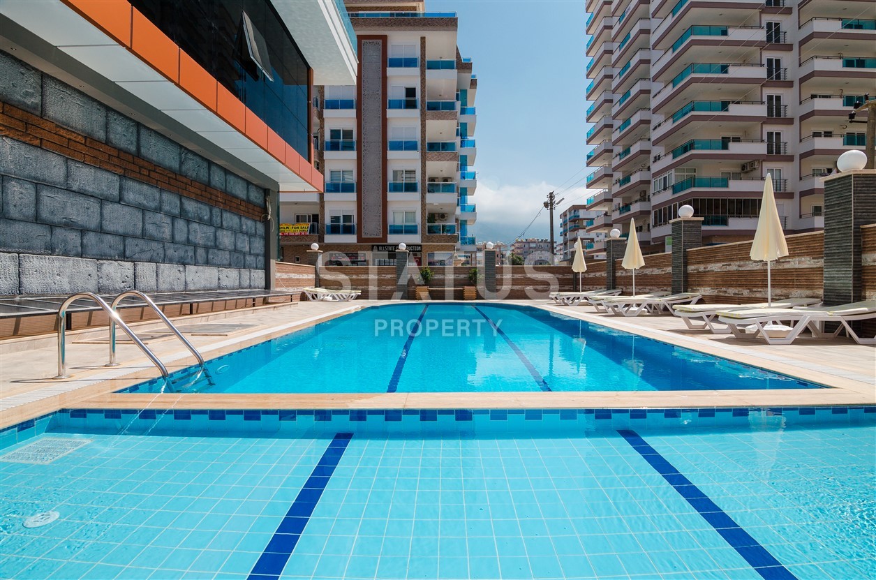 Недвижимость в Алании  у самого берега моря в популярном районе Махмутлар фото 6