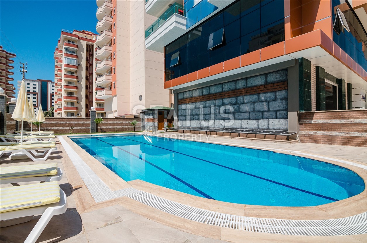 Недвижимость в Алании  у самого берега моря в популярном районе Махмутлар фото 8