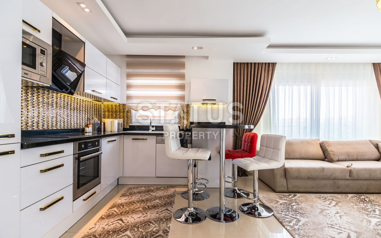 Недвижимость в Алании  у самого берега моря в популярном районе Махмутлар фото 23